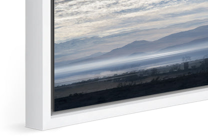 Blue Salton Sea photograph under acrylic glass with white floater frame, close up detail