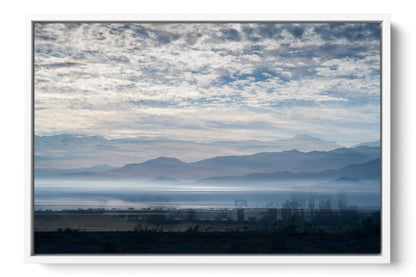 Blue Salton Sea desert lake photograph under acrylic glass with white floater frame, 16 by 24 inch artwork