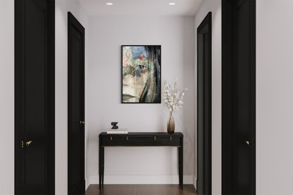 Mirror layered portrait photography print in a black floater frame, displayed above a console table in a modern hallway