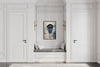 Policeman in Nassau layered portrait photography print in a black floater frame, displayed above a built-in bench in a white paneled hallway
