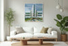 The Breakwater layered photography print displayed above a white sofa in a modern living room interior