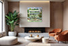 The Pelican layered photography print displayed above a fireplace in a modern living room interior