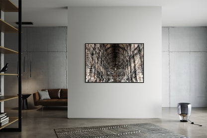 Trinity Library layered photography print in a black floater frame, displayed on a white wall in a concrete loft living room